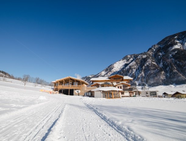 feriendorf-ponyhof-fusch-grossglockner-winter-zon-sneeuw.jpg