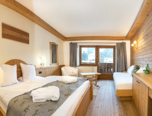 frohnatur-garni-hotel-thiersee-slaapkamer-extra-bed.jpg