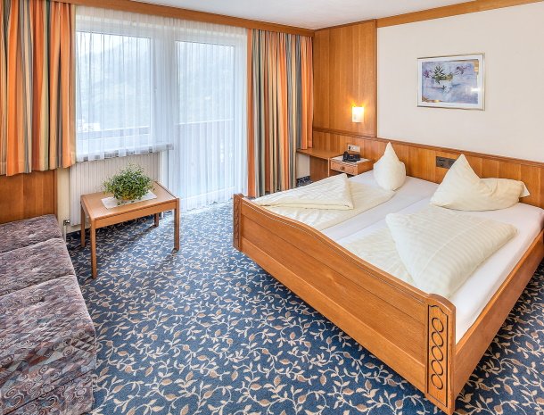 hotel-sailer-wenns-kinderhotel-kamer-bed.jpg