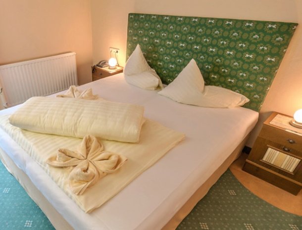 bed-and-breakfast-dorfplatz-pitztal-slaapkamer-bed.jpg