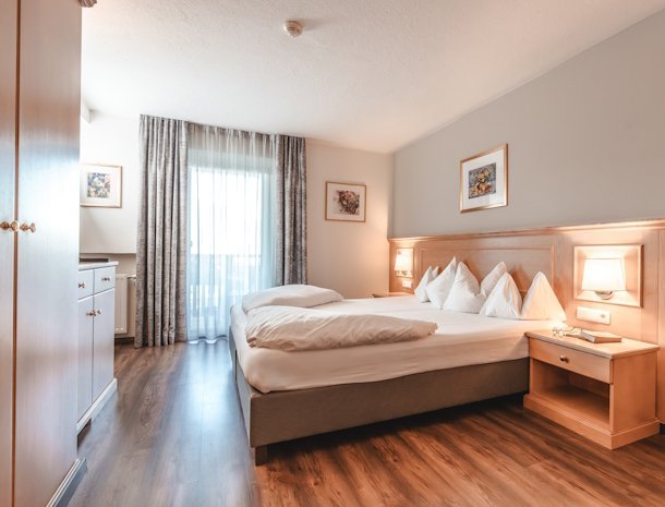 Hotel-Reischach-Kronplatz-familiekamer-bed.jpg